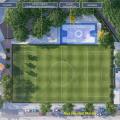 Perspectiva do complexo esportivo, com campo de futebol ao centro e área cobertas na laterais. Imagem é vista do alto. #paratodosverem