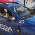 viatura da guarda municipal parada em frente a uma escola. #paratodosverem