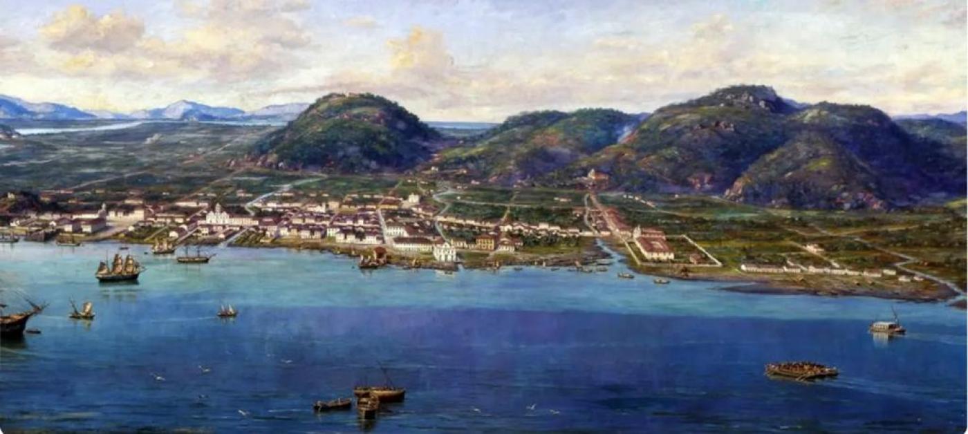 paisagem de santos em 1822, com o mar em primeiro plano e o porto ao fundo. Há poucas construções, predominantemente formadas por bangalôs e igrejas. #paratodosverem